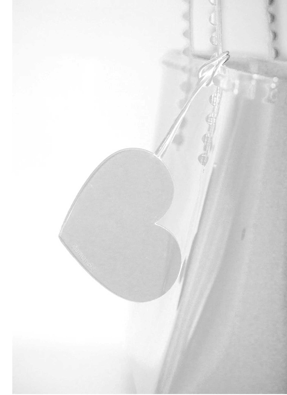 Sustainable white charms for bags from Carmen Sol which is cute and heart shaped