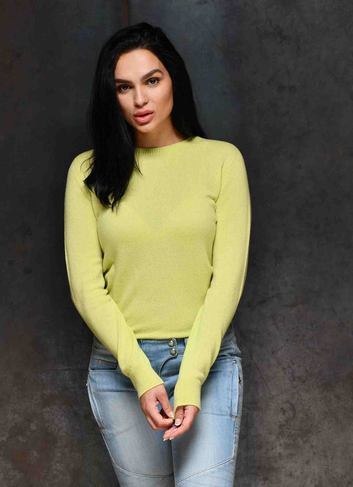 Women wearing Yellow round neck cashmere sweaters which are made in Italy