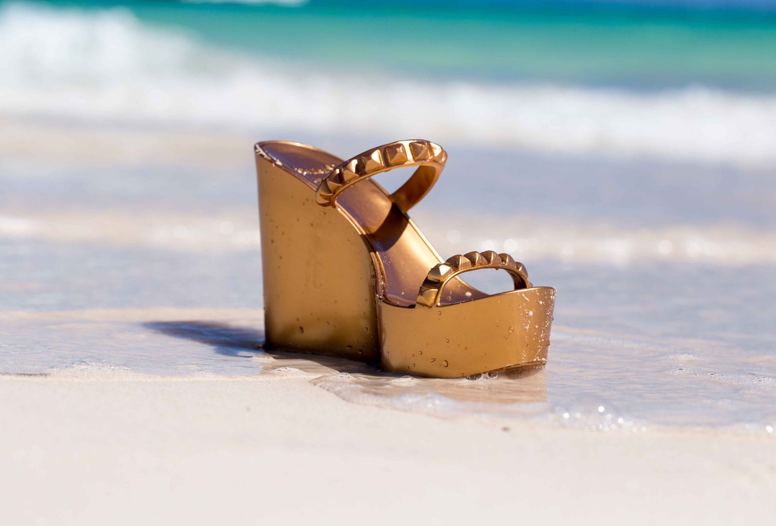 Striking Elegance: The Gold Heels & Black Slides Trend