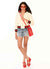 Women wearing red jelly shoulder bag with tonino wedge and red sunglasses.