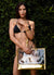 Top model wearing a Carmen Sol clear gold bag with transparent pvc and a black bathing suit and gold bracelets