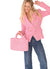 Women carries pink Positano Raffia Small Bag a chic accessory for beach lovers and avid shoppers alike from Carmen Sol.