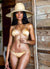 Gorgeous girl in bathing suit wearing wide brim sun hat in color nude