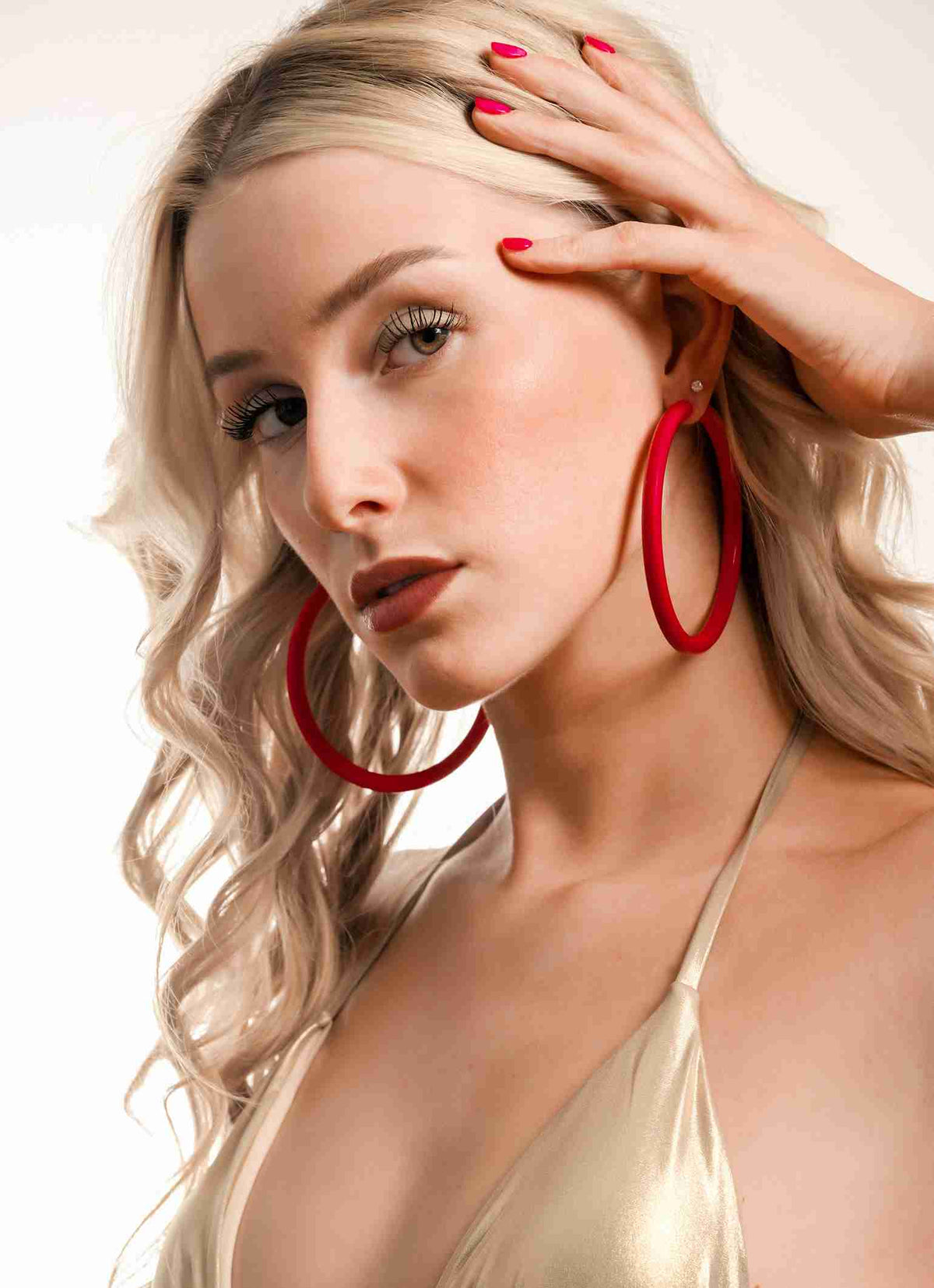 Carmen Sol Red hoop earrings dance with your every step. earrings for women