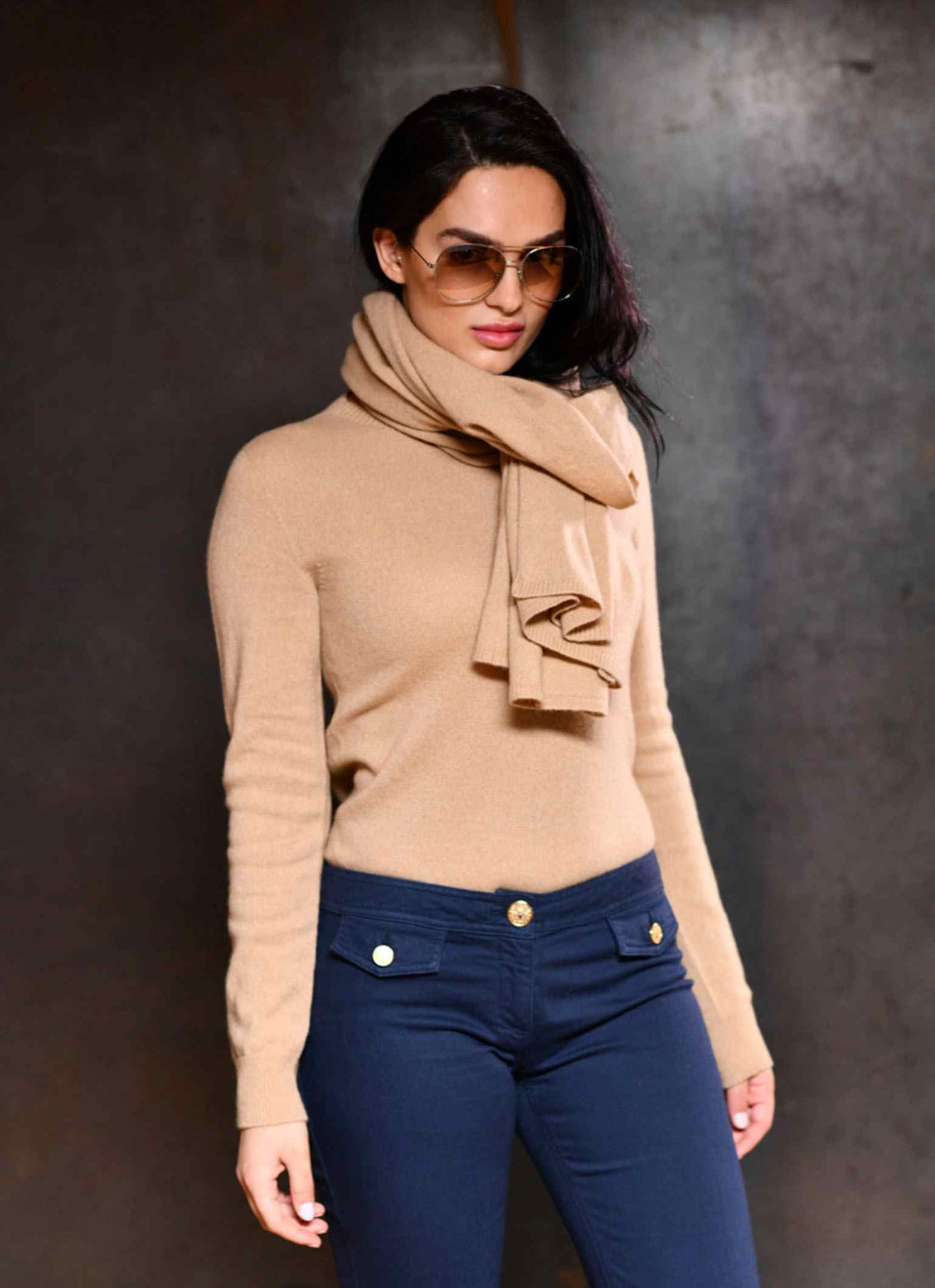 Women wearing Carmen Sol cashmere scarf with matching cashmere in color camel