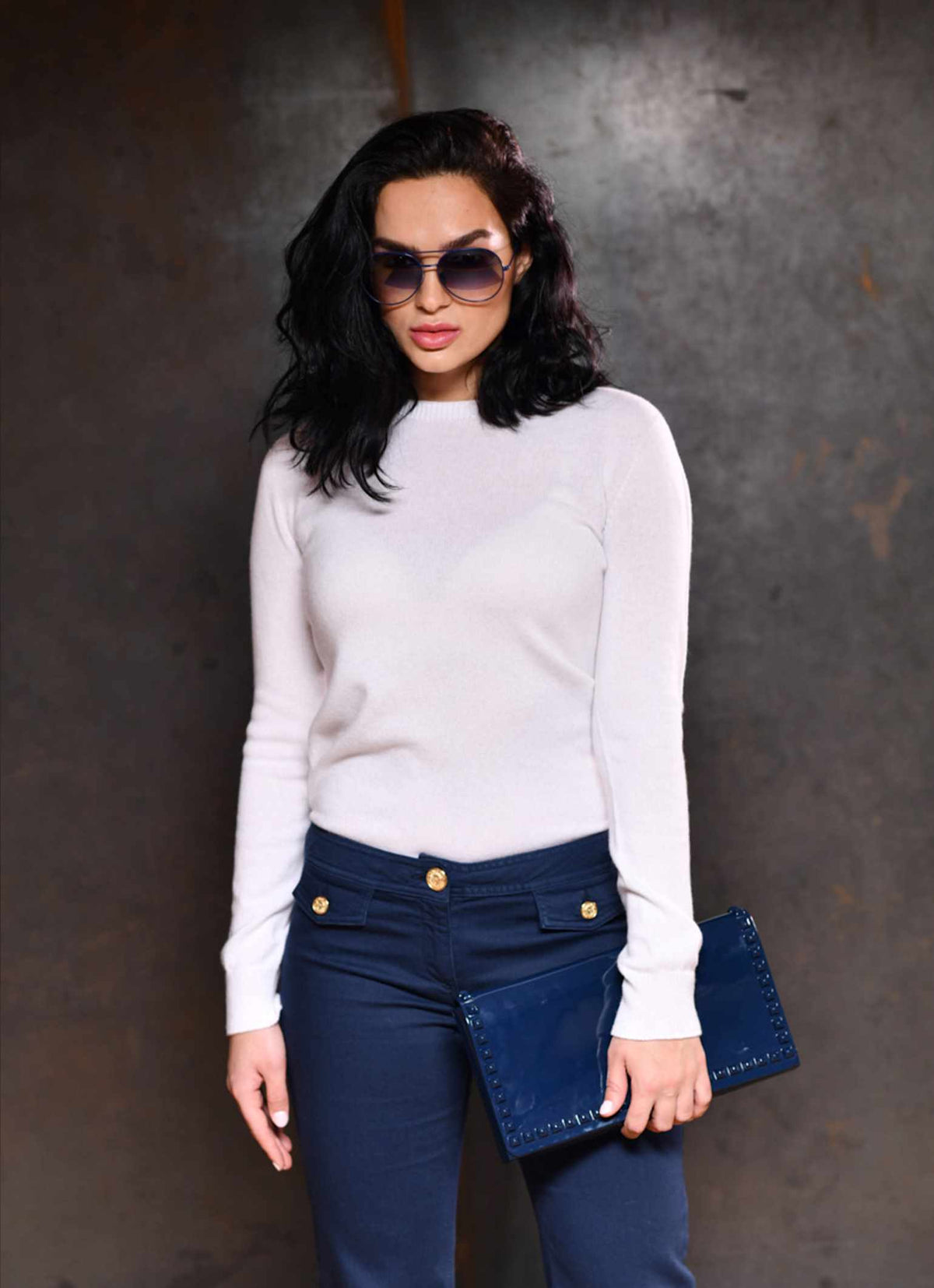 Women wearing Cortina 100% pure round neck cashmere sweater in color white with jelly purses and sunglasses