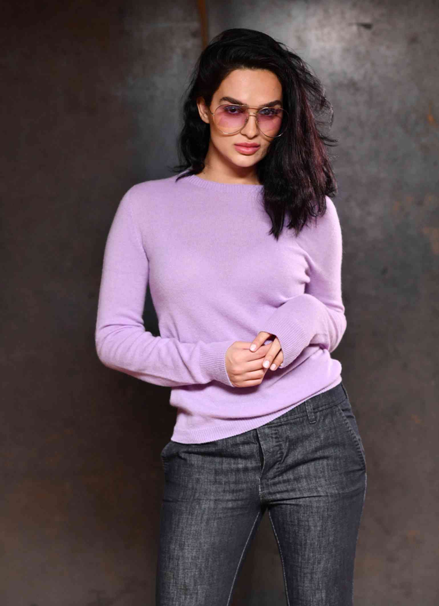 Women wearing round neck Made in Italy pure cashmere sweater in color violet