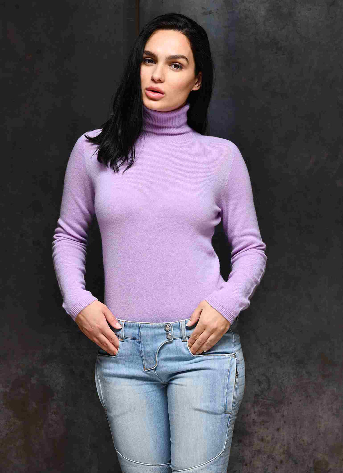 Women wearing turtleneck cashmere sweaters which are made from soft Italian cashmere in color violet