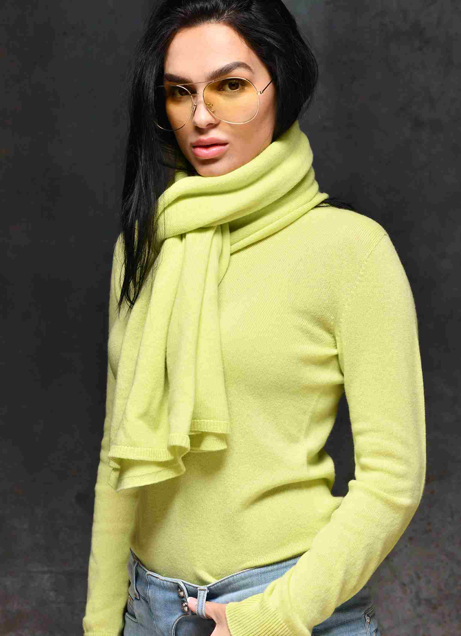 Sunglasses for women in color gold worn with yellow cashmere sweater and matching scarf