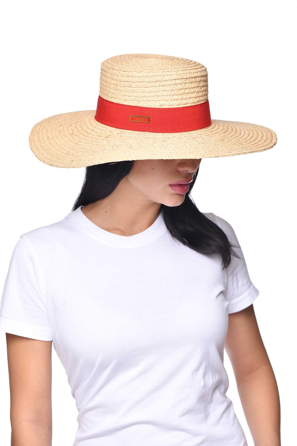Women wearing Carmen Sol Mirtha raffia bucket hat in color red