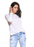 Women wearing long sleeve tees with round neck in color white from Carmen Sol with jeans