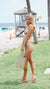 Woman in bathing suit wearing Carmen Sol jelly sandals along with jelly tote bag for the beach