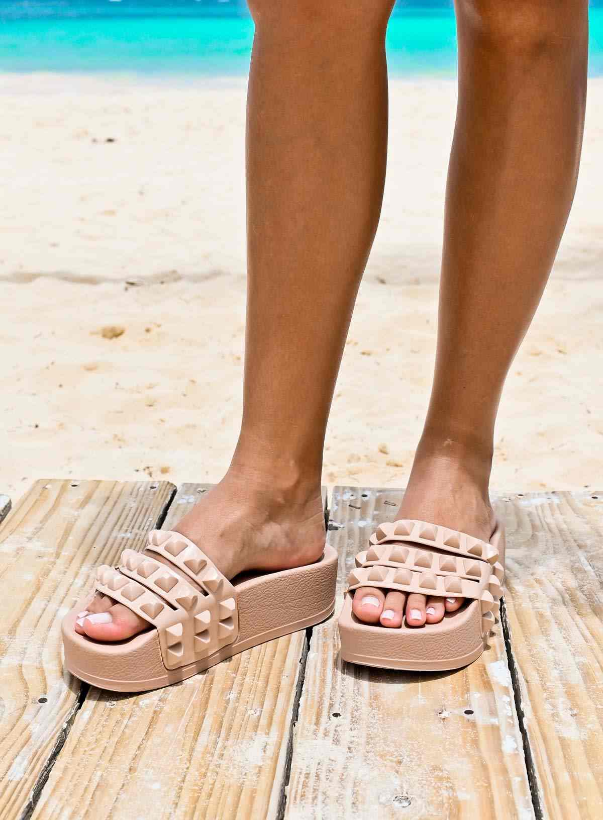 Best Beach slide sandals for beach lover from Carmen sol. Reach for the sky and rock your beach style with platform flip-flops